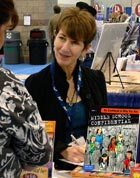Parenting expert Annie Fox, M.Ed. signing one of her books